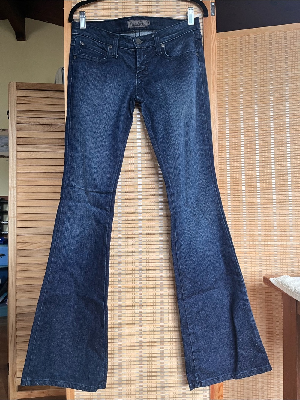 Frankie B. Dark Blue low rise Jeans, slim fit with boot cut and embroidered wave